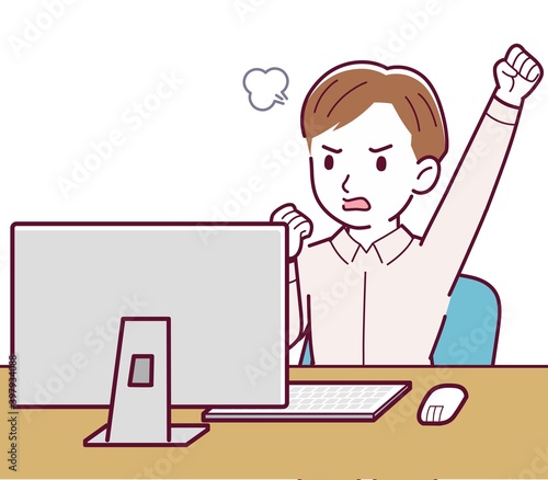 A man in a pink shirt using a computer