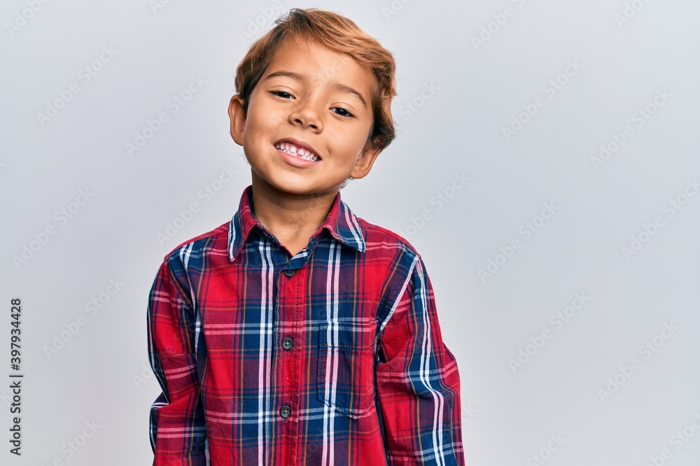 Adorable latin kid wearing casual clothes with a happy and cool smile on face. lucky person. Adorable latin kid wearing casual clothes with a happy and cool smile on face. lucky person.