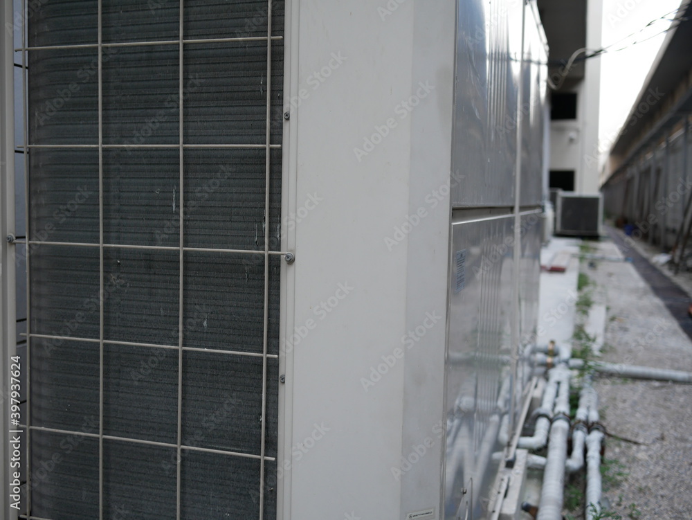 air conditioner compressor outside building.
air conditioner compressor outside building.