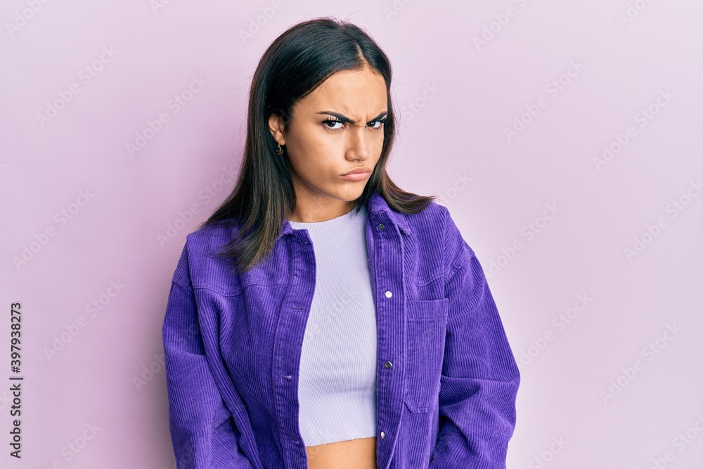 Fototapeta premium Young brunette woman wearing casual clothes skeptic and nervous, frowning upset because of problem. negative person.
