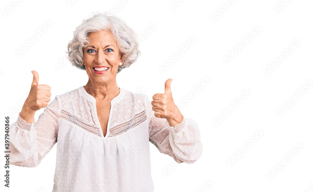 Senior grey-haired woman wearing casual clothes success sign doing positive gesture with hand, thumbs up smiling and happy. cheerful expression and winner gesture. Senior grey-haired woman wearing casual clothes success sign doing positive gesture with hand, thumbs up smiling and happy. cheerful expression and winner gesture.