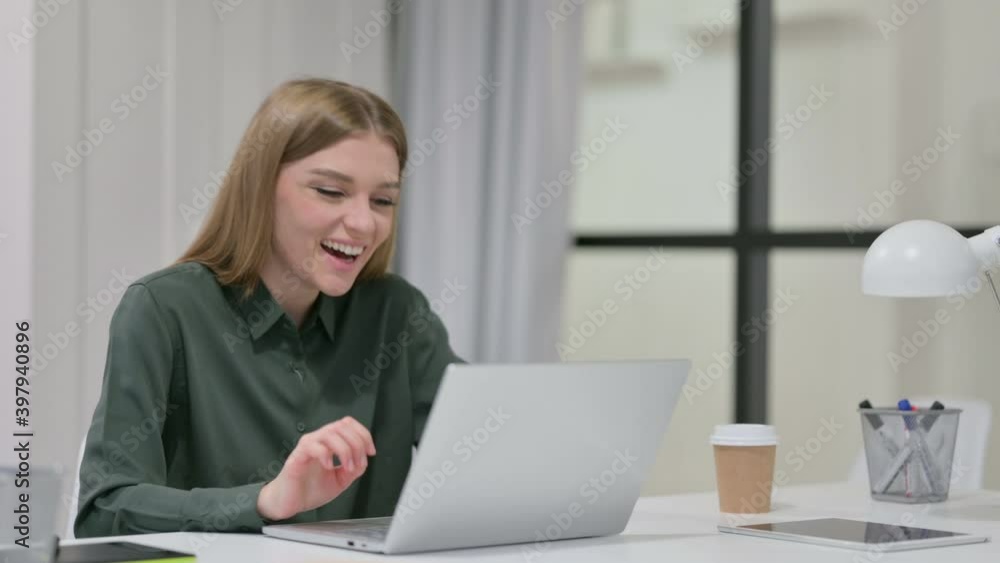 Successful Young Woman Celebrating on Laptop Successful Young Woman Celebrating on Laptop