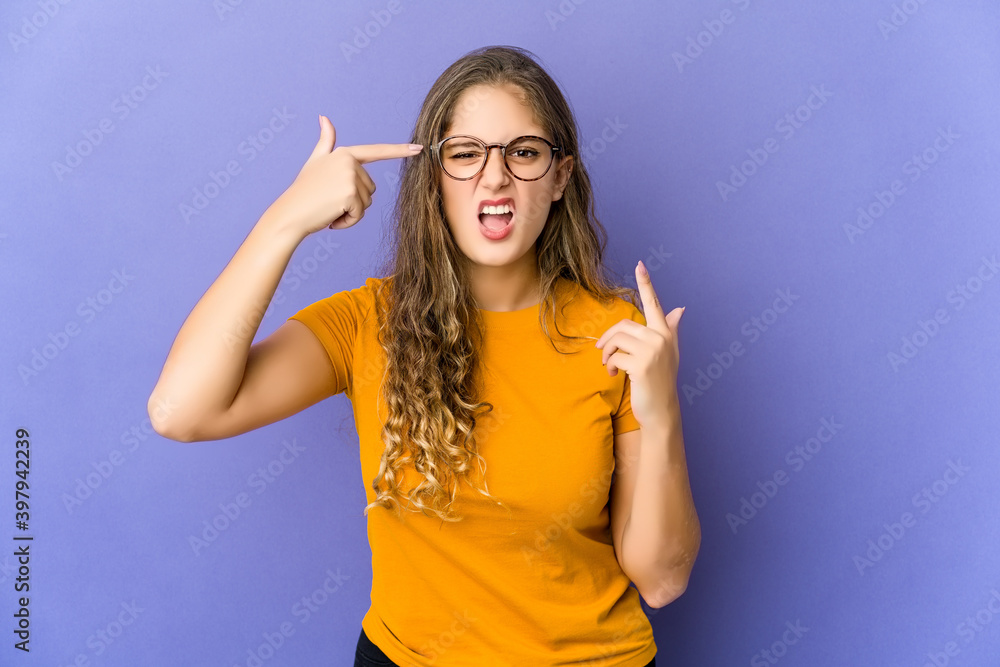 Young caucasian cute woman showing a disappointment gesture with forefinger. Young caucasian cute woman showing a disappointment gesture with forefinger.