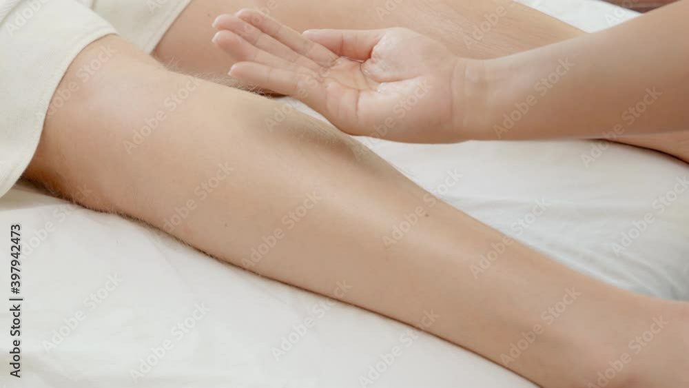 4K Handsome Caucasian man lying on spa bed get leg massage treatment with aroma essential oil skincare from professional massage therapist at beauty salon. Wellness body massage and spa concept 4K Handsome Caucasian man lying on spa bed get leg massage treatment with aroma essential oil skincare from professional massage therapist at beauty salon. Wellness body massage and spa concept