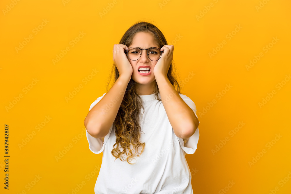 Young caucasian woman crying, unhappy with something, agony and confusion concept. Young caucasian woman crying, unhappy with something, agony and confusion concept.