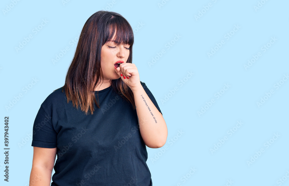 Young plus size woman wearing casual clothes feeling unwell and coughing as symptom for cold or bronchitis. health care concept. Young plus size woman wearing casual clothes feeling unwell and coughing as symptom for cold or bronchitis. health care concept.