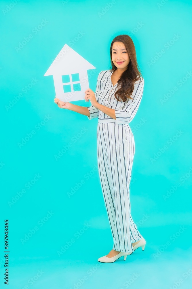 Portrait beautiful young asian woman show home or house sign Portrait beautiful young asian woman show home or house sign