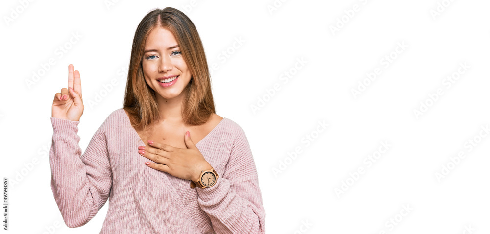 Beautiful blonde woman wearing casual winter pink sweater smiling swearing with hand on chest and fingers up, making a loyalty promise oath Beautiful blonde woman wearing casual winter pink sweater smiling swearing with hand on chest and fingers up, making a loyalty promise oath
