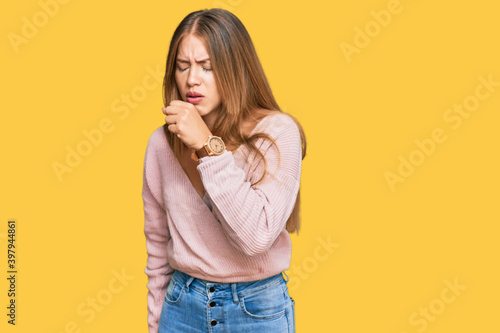 Beautiful blonde woman wearing casual winter pink sweater feeling unwell and coughing as symptom for cold or bronchitis. health care concept.