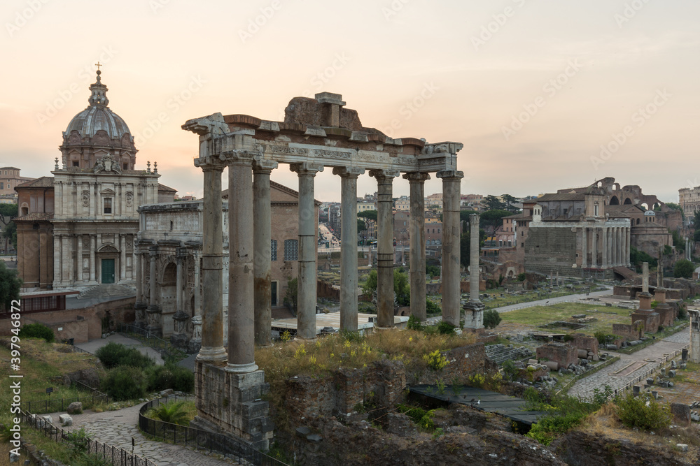 Sunrise landscapes of the empty Roman Forum, view of the Temple of Vespasian and Titus