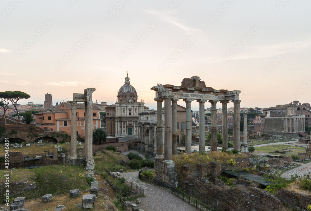 Sunrise landscapes of the empty Roman Forum, view of the Temple of Vespasian and Titus
