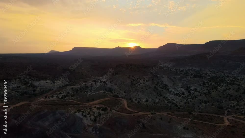Cinematic aerial flyover of colorful sandstone strata at sunset in Southern Utah Cinematic aerial flyover of colorful sandstone strata at sunset in Southern Utah