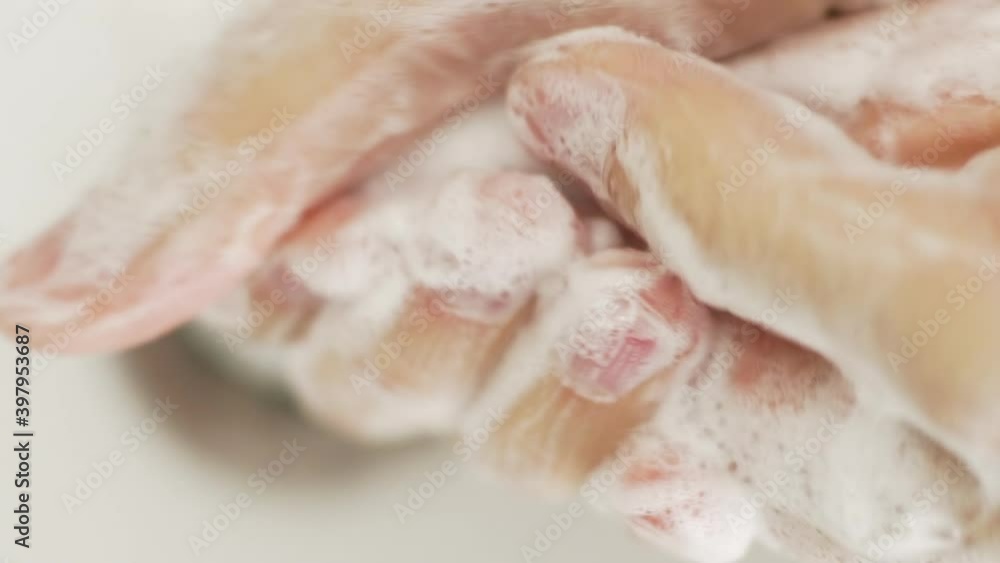 Male caucasian washes hands thoroughly, high angle close up shot Male caucasian washes hands thoroughly, high angle close up shot