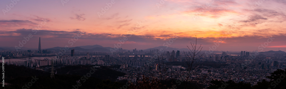 Panoramic view of Seoul from Achasan Mountain during the early evening. 