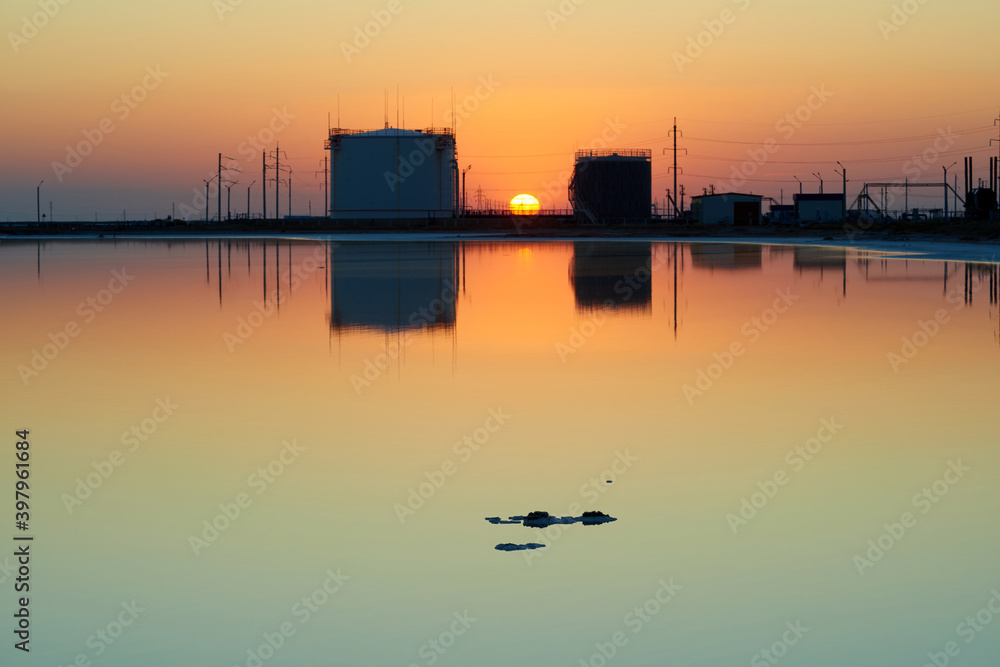 Oil tank at sunset in Mangistau region. Kazakhstan. World Oil Industry.