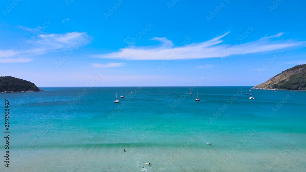 4K Phuket Thailand. Aerial view of Tropical aerial landscape with girls. Tanning woman wearing sun hat at the beach on a white sand shot from above. Azure water, sandy Tropical Beach. Top view, loop 4K Phuket Thailand. Aerial view of Tropical aerial landscape with girls. Tanning woman wearing sun hat at the beach on a white sand shot from above. Azure water, sandy Tropical Beach. Top view, loop