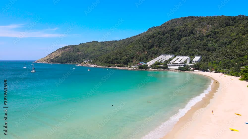 4K Phuket Thailand. Aerial view of Tropical aerial landscape with girls. Tanning woman wearing sun hat at the beach on a white sand shot from above. Azure water, sandy Tropical Beach. Top view, loop 4K Phuket Thailand. Aerial view of Tropical aerial landscape with girls. Tanning woman wearing sun hat at the beach on a white sand shot from above. Azure water, sandy Tropical Beach. Top view, loop