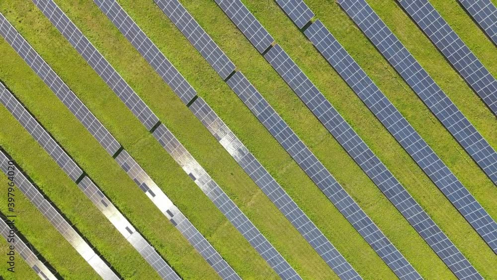 Aerial view of solar power plant, source of ecological renewable energy. Flying over solar panels. Aerial view of solar power plant, source of ecological renewable energy. Flying over solar panels.