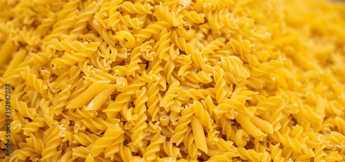 lose up of spiral macaroni pasta uncooked