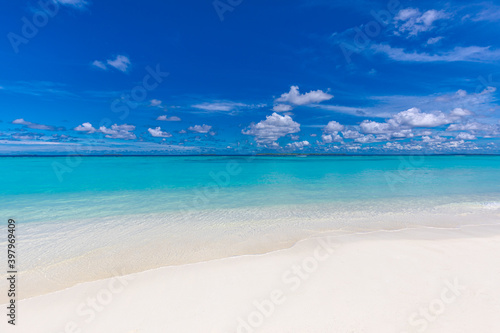 Fototapeta Naklejka Na Ścianę i Meble -  Sea sand sky concept. Closeup of sand on beach and blue summer sky, calmness and inspiration nature concept. Summer seascape beautiful waves, blue sea water in sunny day. 