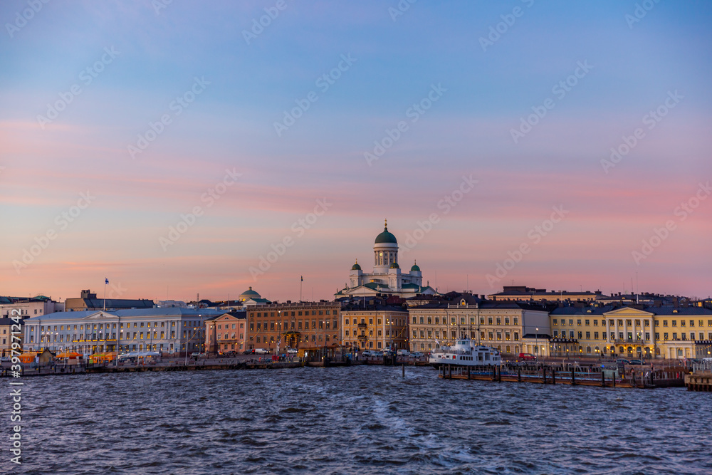 Helsinki, Finland. Scenic cityscape with Helsinki Cathedral, South Harbor, Market Square and beautiful Sunset clouds ,