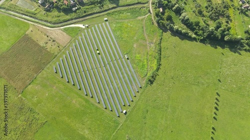 Aerial view of solar power plant, source of ecological renewable energy. Flying over solar panels.