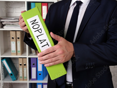 Fotografie Business concept about Net Operating Profit Less Adjusted Tax NOPLAT with sign on the piece of paper