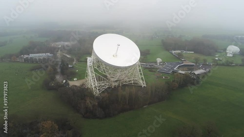 Aerial Jodrell bank observatory Lovell telescope misty rural countryside high orbit left photo