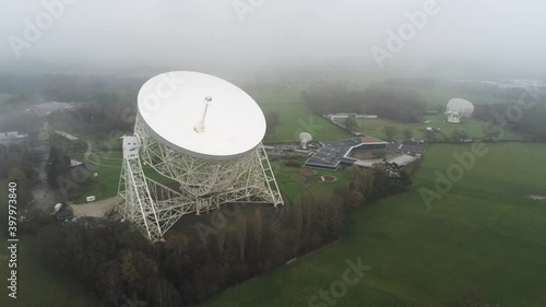 Aerial Jodrell bank observatory Lovell telescope misty rural countryside left orbit slow photo