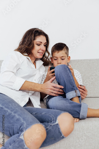 Mom and son watch smartphone games online