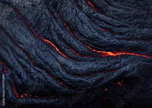 Active lava flow volcanic eruption magma touching the in Big Island, Kilauea volcano, Hawaii, usa