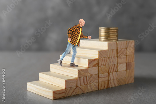 Stacked blocks with coins a...