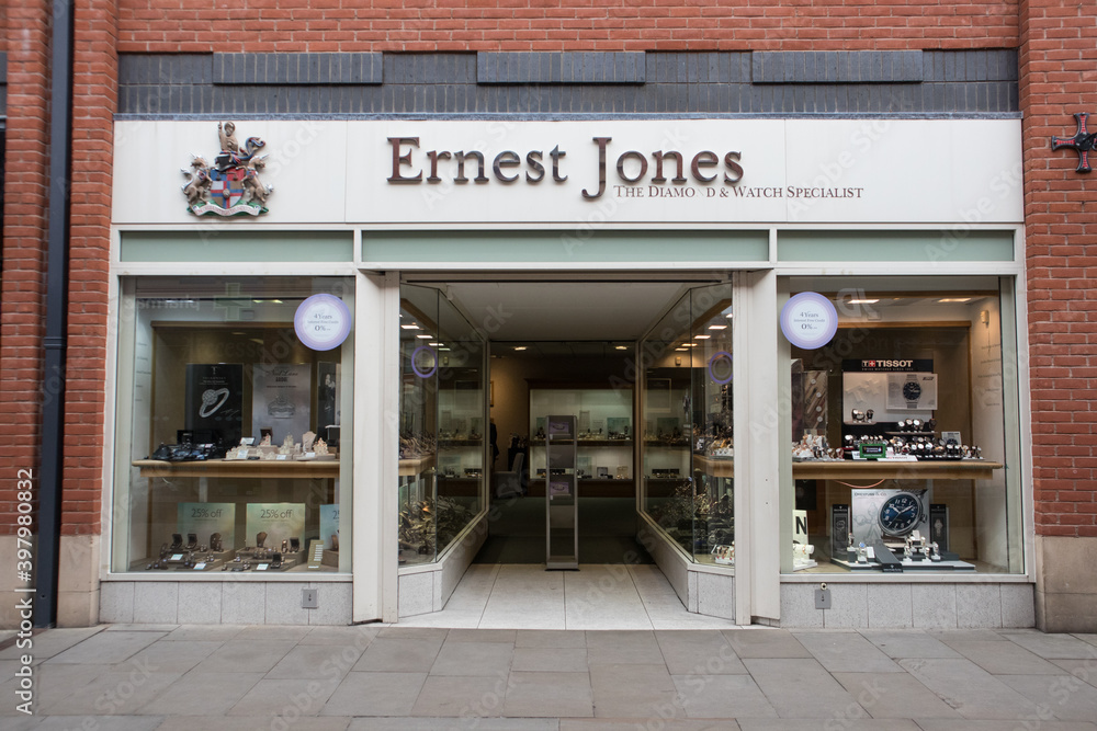 Entrance to Ernest Jones Jewellers store shop showing logo, sign 