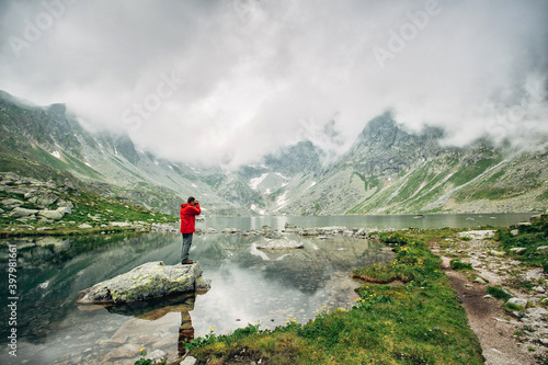 Traveler at Lake Hincovo Pleso in High Tatras. © serkucher