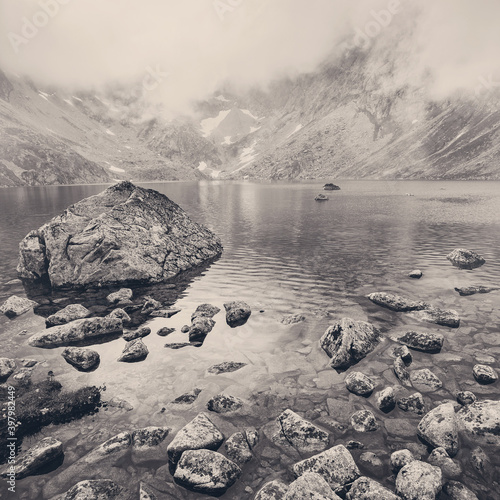 Lake in foggy mountains in the High Tatras.