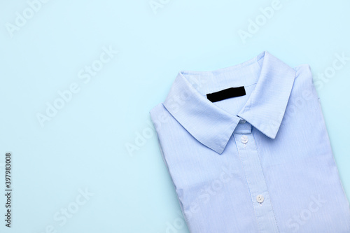 Stylish male shirt on color background