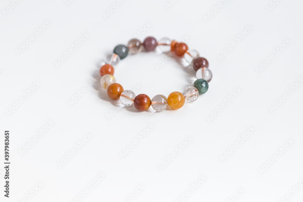 Agate Natural Stone Wristband on white background, mixed Gemstones and natural stones for energy healing and calmness Agate Natural Stone Wristband on white background, mixed Gemstones and natural stones for energy healing and calmness