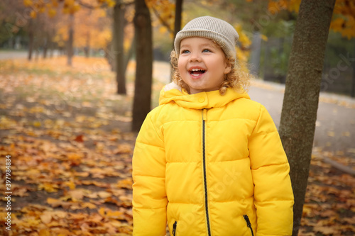 Wallpaper Mural Cute little girl in autumn park Torontodigital.ca