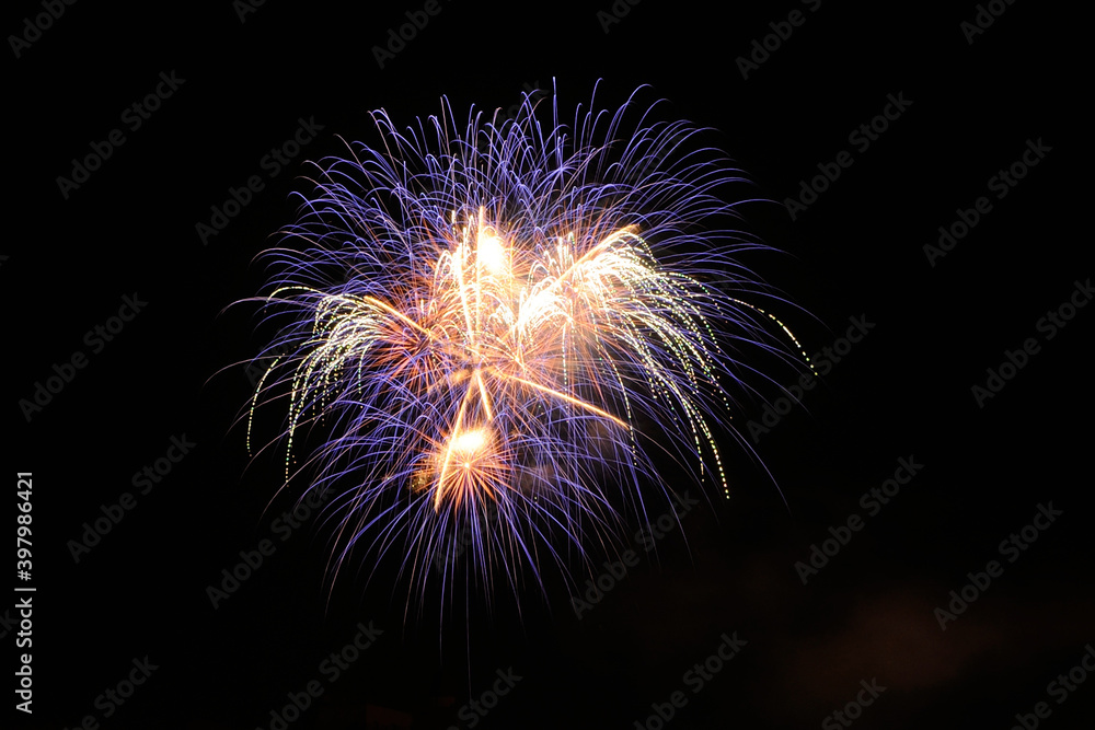 Festive fireworks on a black background. Abstract festive background. International Fireworks Festival in honor of the City Day, Murmansk. Festive fireworks on a black background. Abstract festive background. International Fireworks Festival in honor of the City Day, Murmansk.