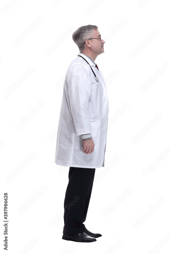 side view. a smiling doctor reading an ad on a white wall side view. a smiling doctor reading an ad on a white wall