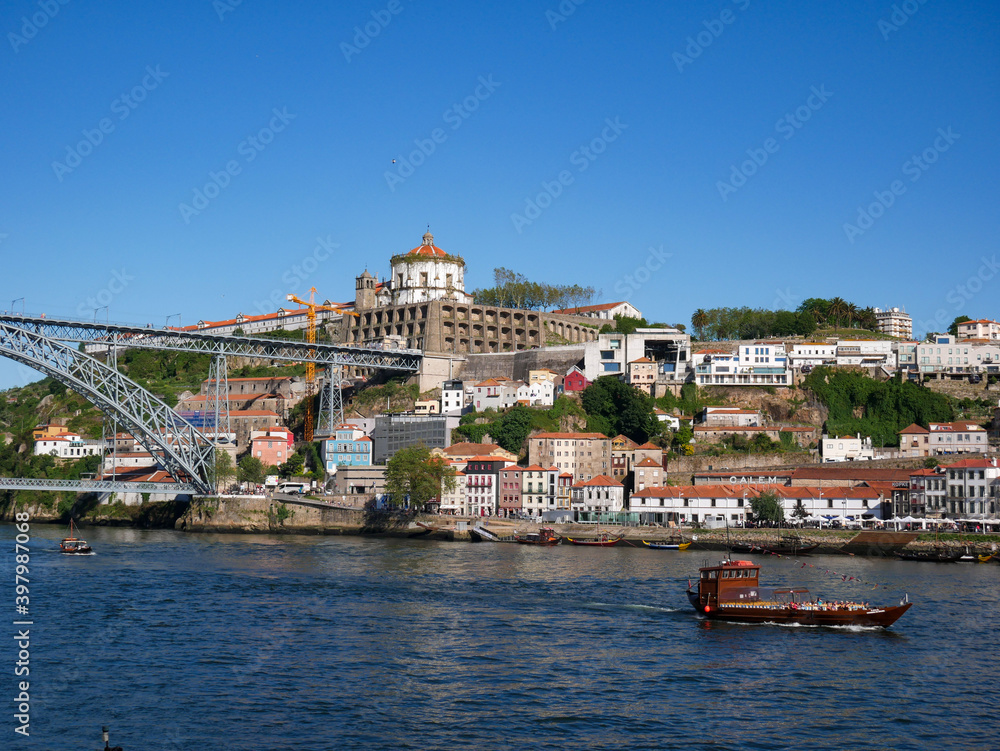 Colourful tour boat sailing on the Douro river,