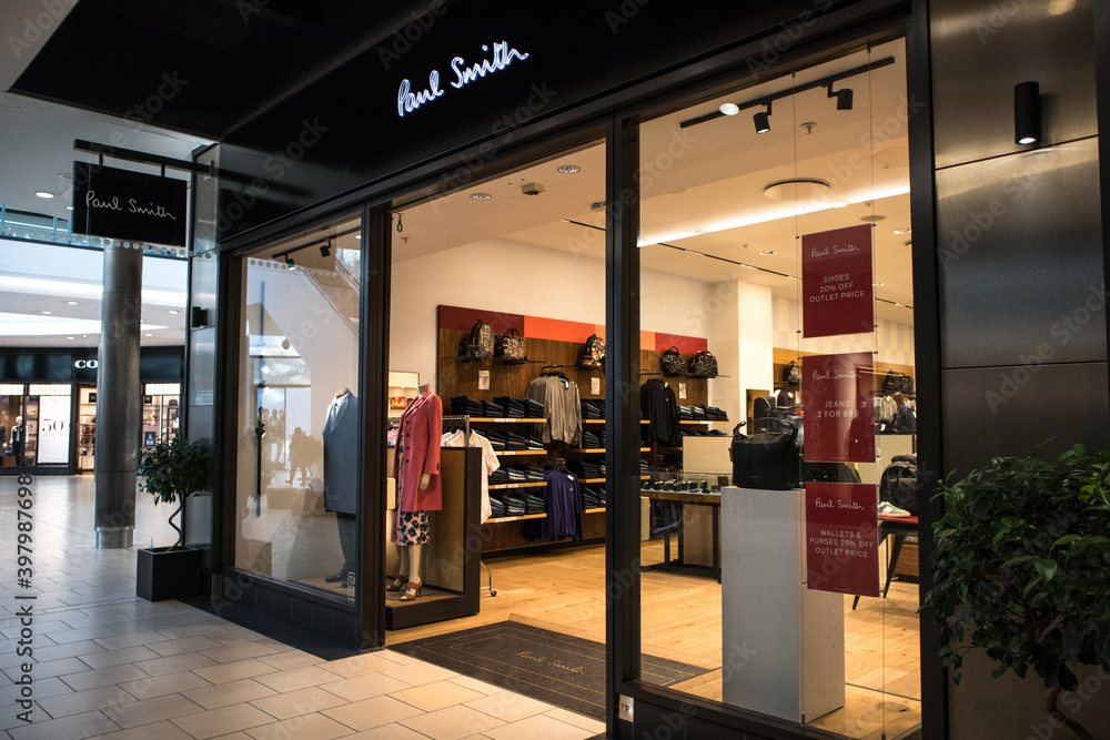 Entrance to Paul Smith fashion clothing shop store showing window display,  sign, signage, logo and branding. Stock Photo | Adobe Stock