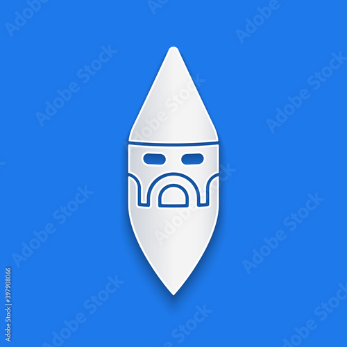 Paper cut Wizard warlock icon isolated on blue background. Paper art style. Vector.