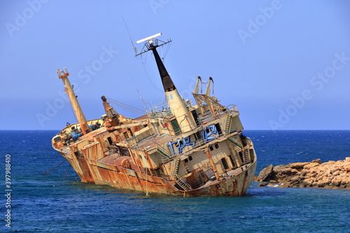 Shipwreck of the abandoned ship Edro III on a rocky coast at Akrotiri Beach in Cyprus