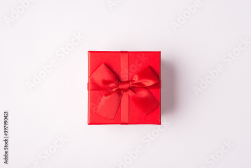 Top above overhead close up view photo of small present red bright box isolated over white color background