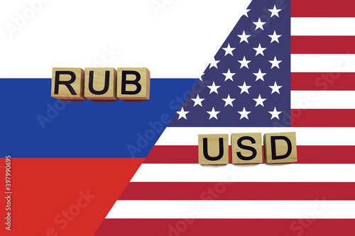 Russia and USA currencies codes on national flags background