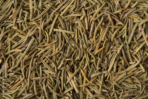 Close up view photo image of textured backdrop made of dried rosemary spice