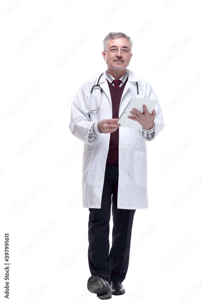 smiling doctor looking at the screen of a digital tablet. smiling doctor looking at the screen of a digital tablet.
