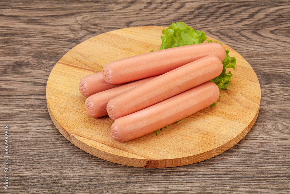Tasty meat sausages over board Tasty meat sausages over board