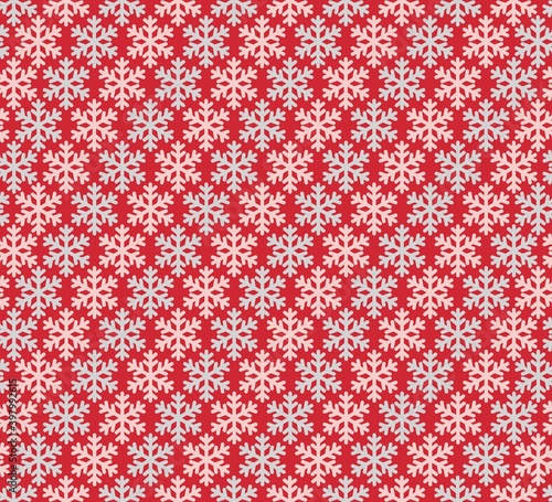 seamless texture light pink and light blue snowflakes on a red background